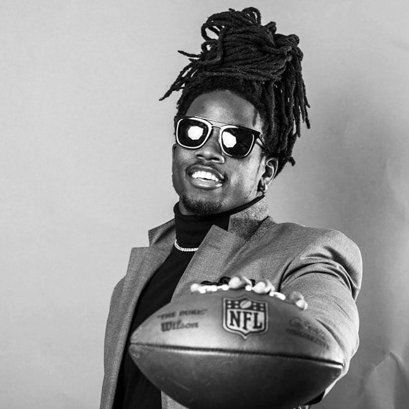 Melvin holding a football
