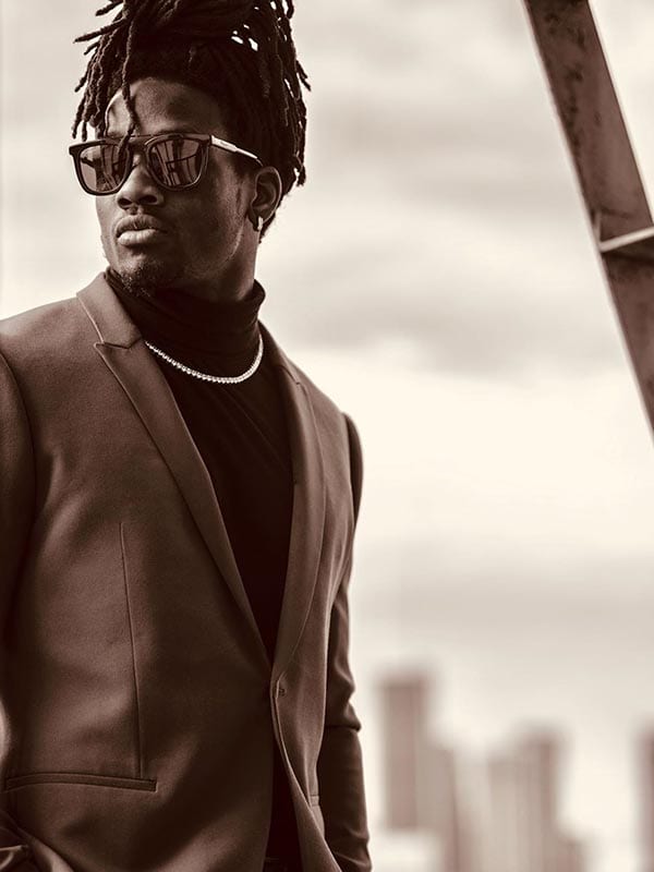 Melvin in a suit and shades